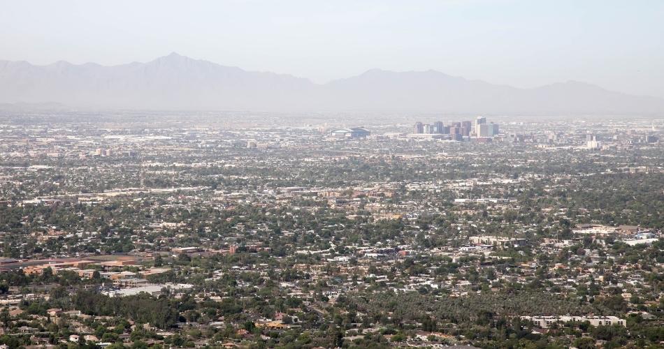 The city of phoenix, arizona, is covered with a haze caused by extreme heat due to the urban heat island effect.